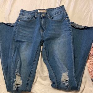Wide bootcut jeans with rips. Light wash. Only tried on so brand new.